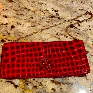 Red faux snakeskin clutch
